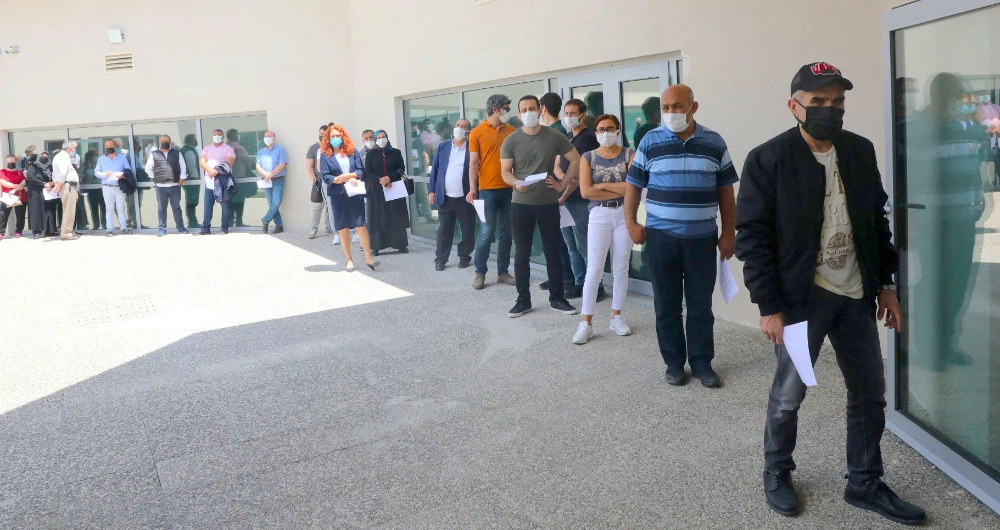 People queue up to receive the Pfizer vaccine in Ankara. (AFP)