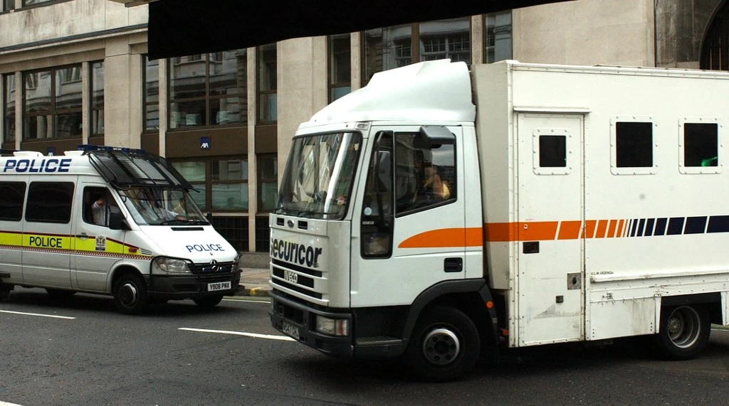 Above, a prison van leaves the Old Bailey in London. Islamist extremism behind bars is making prisoners see violence as acceptable when they were released, a terrorism expert says. (AFP file photo)