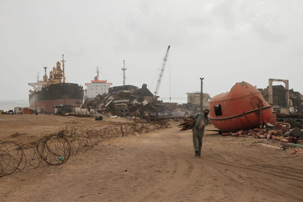 In this photo shared by NGO Shipbreaking Platform on May 31, workers and ship wreckage are seen at a yard in the coastal town of Gadani, Balochistan province, southwestern Pakistan. (Supplied)