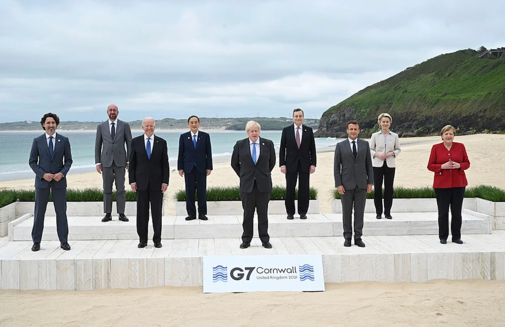 British Prime Minister Boris Johnson greeted world leaders on a wooden boardwalk atop the freshly raked sand of Carbis Bay to open the Group of Seven summit Friday. (AP)