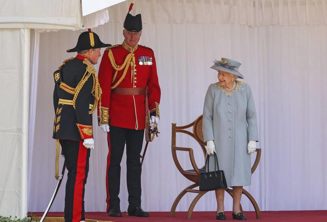 Britain's Queen Elizabeth II watches a military ceremony to mark her official birthday at Windsor Castle on June 12, 2021 in Windsor. (AFP)