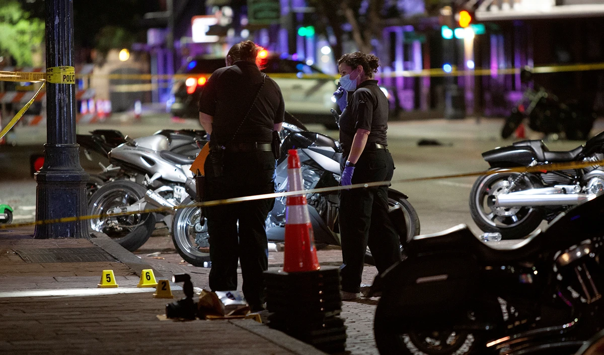 Police investigate the scene of a mass shooting in the Sixth Street entertainment district area of Austin, Texas, US June 12, 2021. (Reuters)