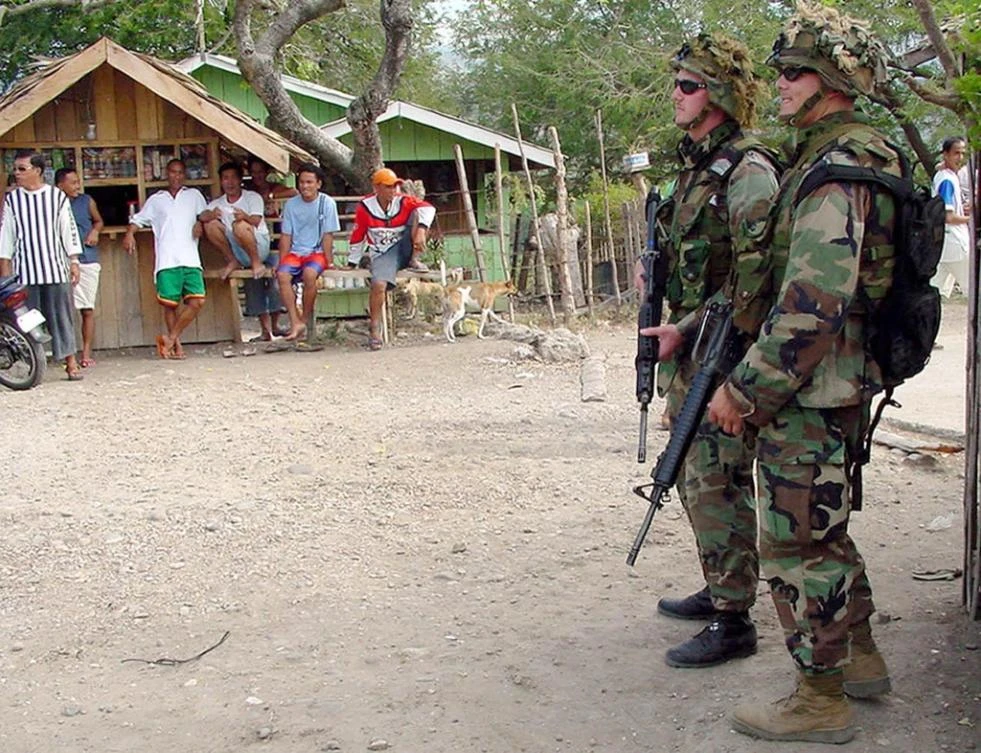 Above, US soldiers on a medical outreach program as part of a 10-month training program in the outskirts of southern Philippine port city of Zamboanga on March 2, 2003. (AFP)