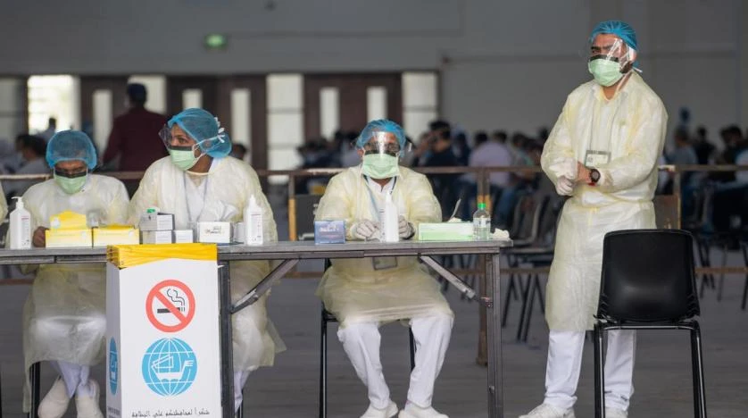 Nurses await to admit expatriates in a makeshift coronavirus testing center at the Mishref Fair Grounds in Kuwait city, Kuwait. Reuters file photo