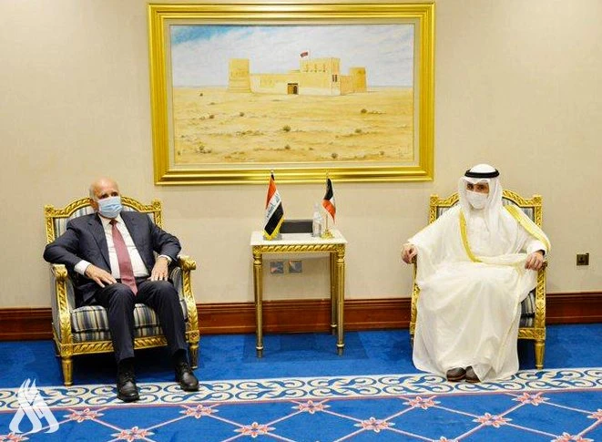 Iraqi Foreign Minister Fouad Hussein met with Kuwait’s Foreign Minister Ahmed Nasser Al-Mohammed Al-Sabah on the sidelines of the consultative meeting of Arab foreign ministers held in Doha. (Photo courtesy: Iraqi News Agency)