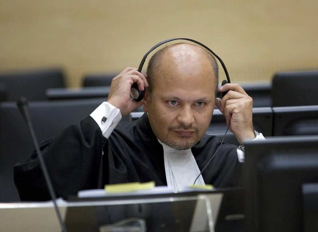 In this Monday, June 4, 2007 file photo, lawyer Karim Khan adjust his headphones in the courtroom of the Special Court for Sierra Leone in The Hague, the Netherlands. (AP)