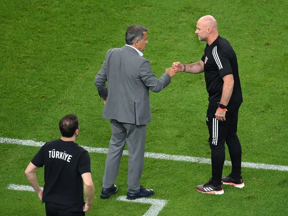 Wales caretaker manager Robert Page with Turkey coach Senol Gunes after their match at Baku Olympic Stadium in Azerbaijan where Wales won 2-0. (Reuters)