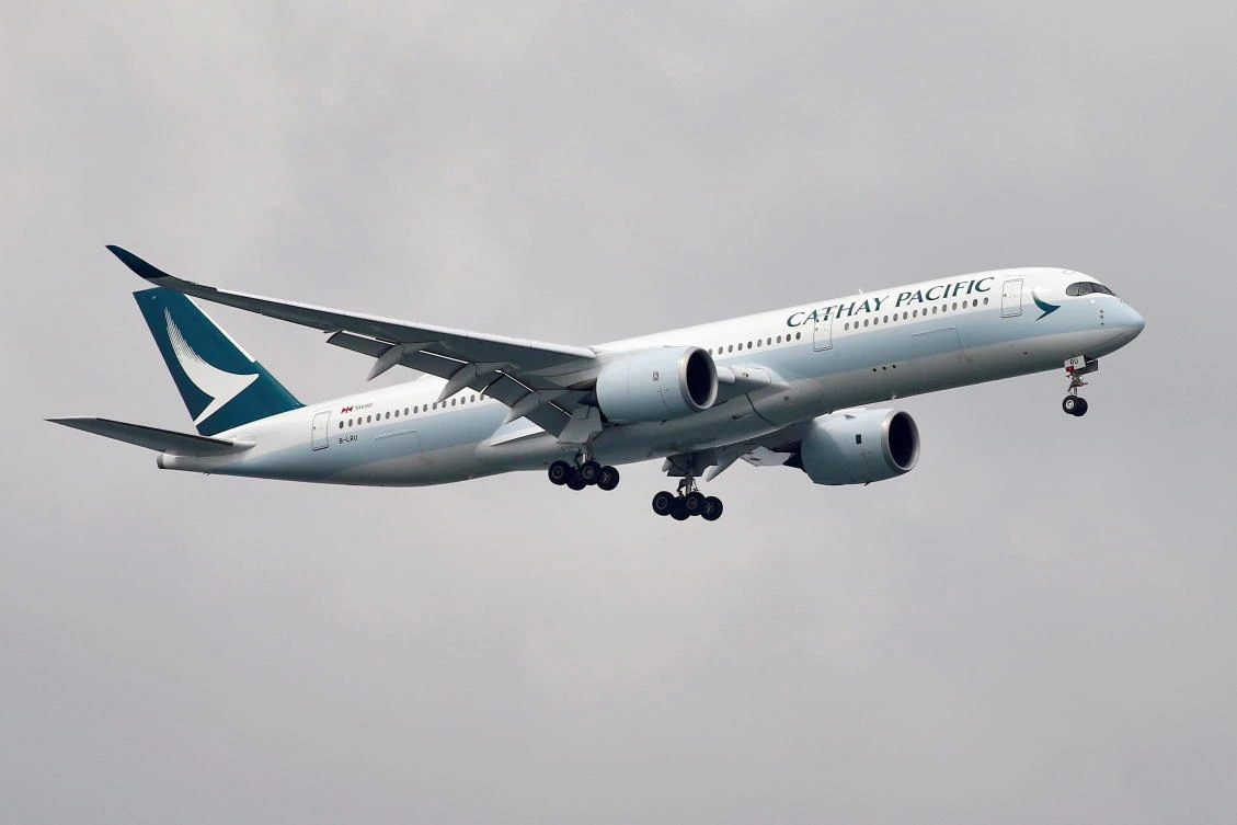 A Cathay Pacific Airways Airbus A350 airplane approaches to land at Changi International Airport in Singapore. (Reuters)