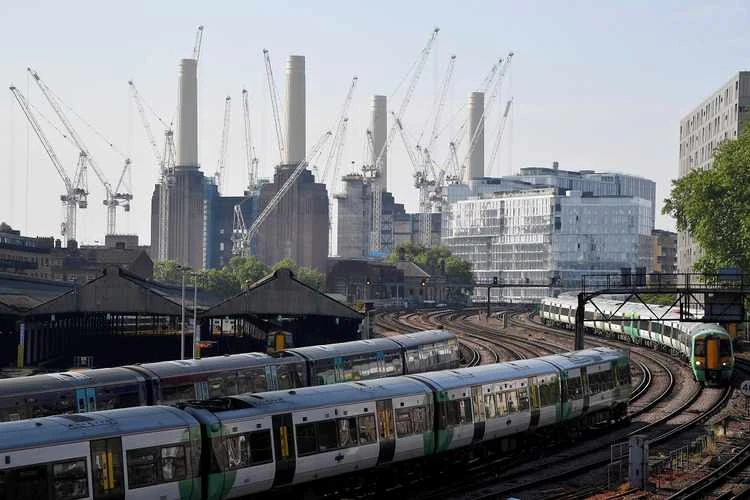 Trains pass near construction work taking place around Battersea Power Station in London, Britain, May 22, 2018. (Reuters)
