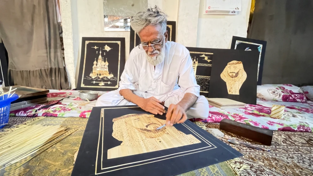 Shah normally sells small, 8-by-12-inch paintings on the footpaths of Peshawar’s bustling Saddar market. (AN photo)