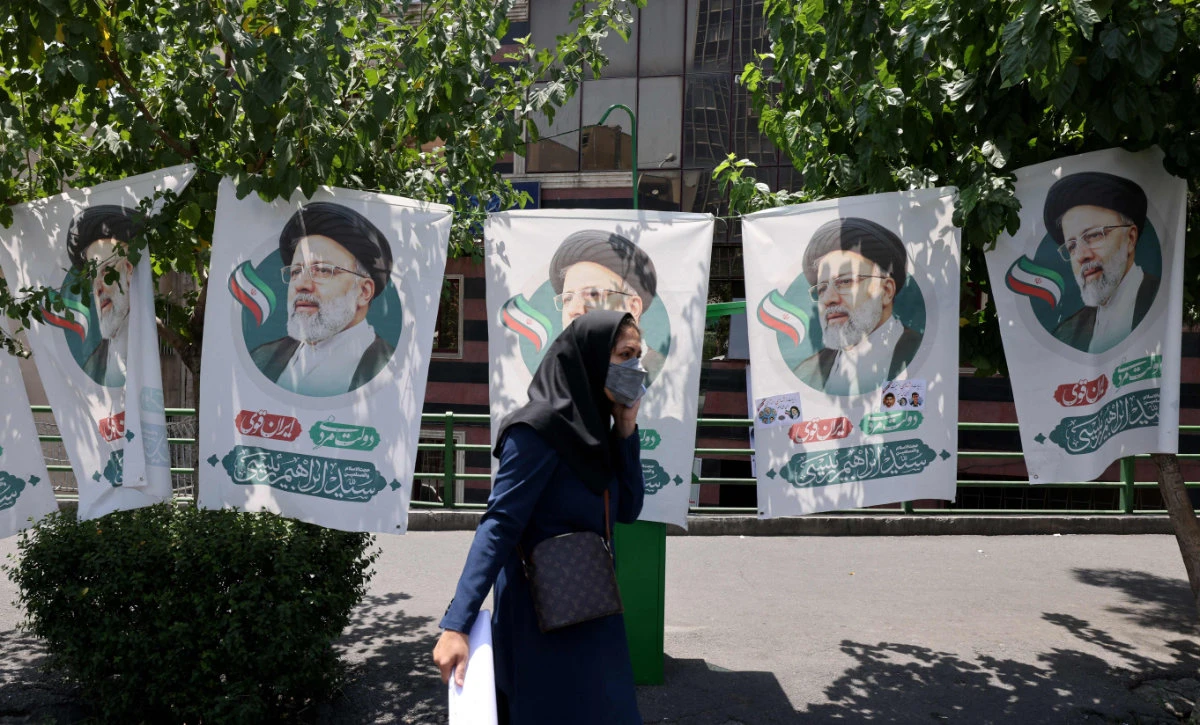 Iranians nonchalant as regime opens poll