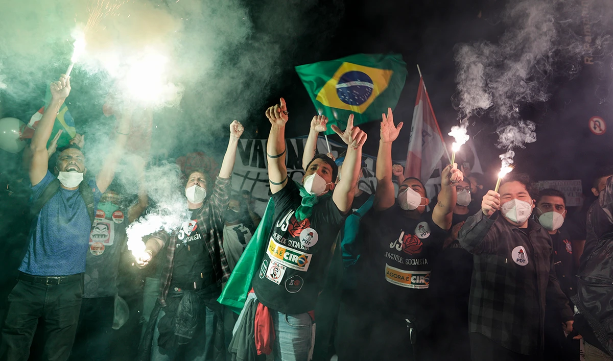 Demonstrators protest against Brazilian President Jair Bolsonaro's handling of the coronavirus pandemic in Sao Paulo, Brazil, Saturday, June 19, 2021. (AP)