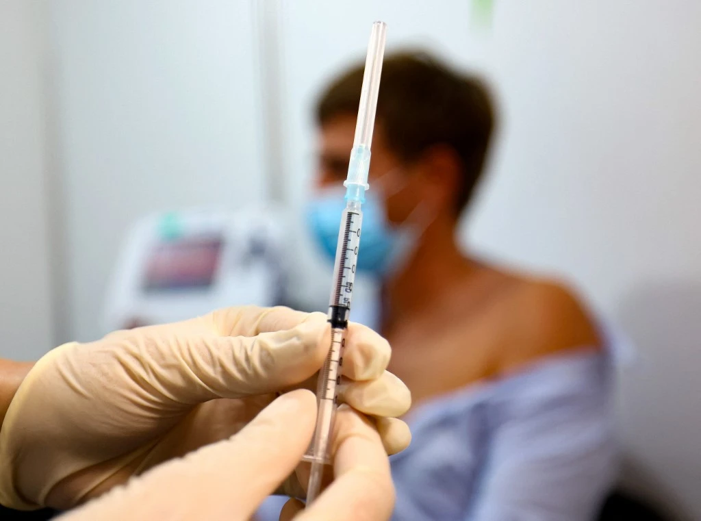 The UAE is among the leading countries in testing and inoculating its populace with a vaccine distribution rate of 145.89 doses per 100 people. (AFP)