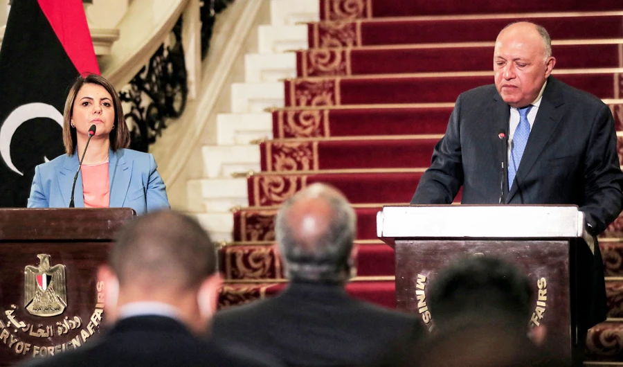 Egypt's Foreign Minister Sameh Shoukri (R) and his Libyan counterpart Najla al-Mangoush (L) give a joint press conference after their meeting in the capital Cairo on June 19, 2021. (AFP)