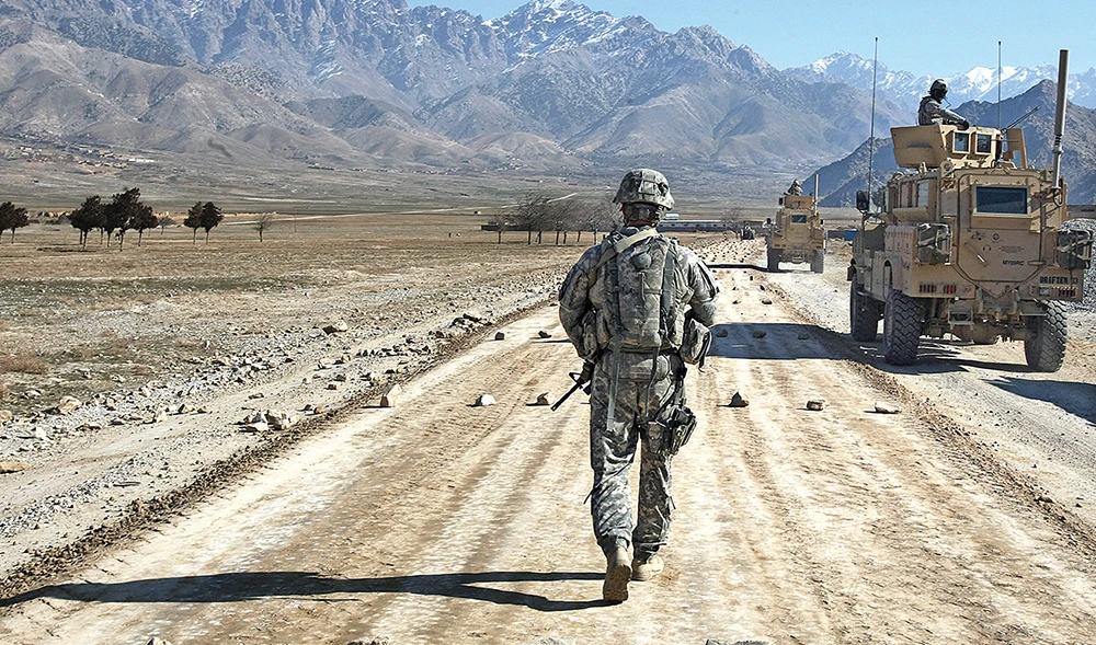 A US soldier from a PRT (Provincial Reconstruction team) at a road under construction near Bagram outside of Kabul. (File/AFP)