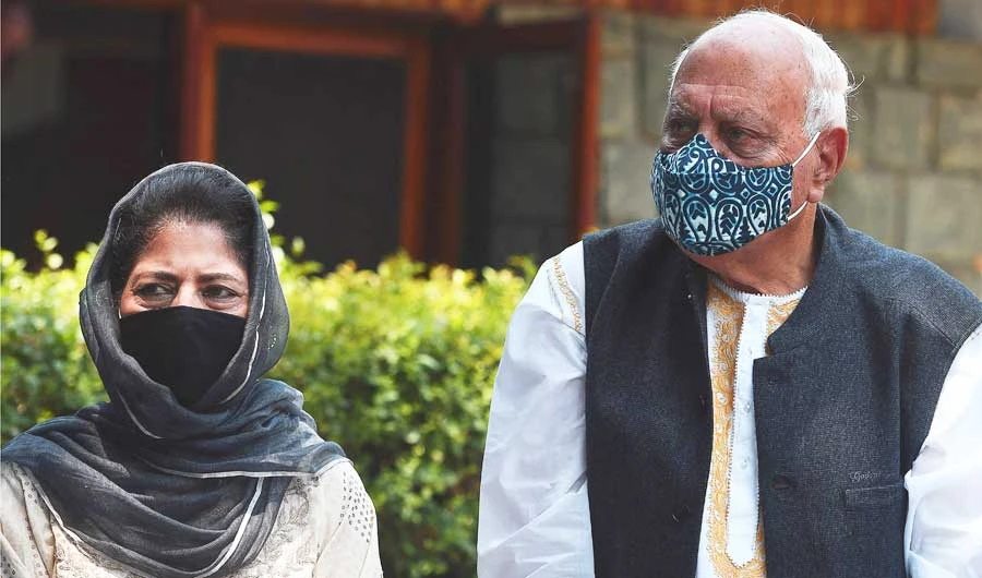 Former Chief Minister of Jammu and Kashmir Mehbooba Mufti, left, with former Chief Minister Farooq Abdullah during a press conference in Srinagar on Tuesday. (AFP)