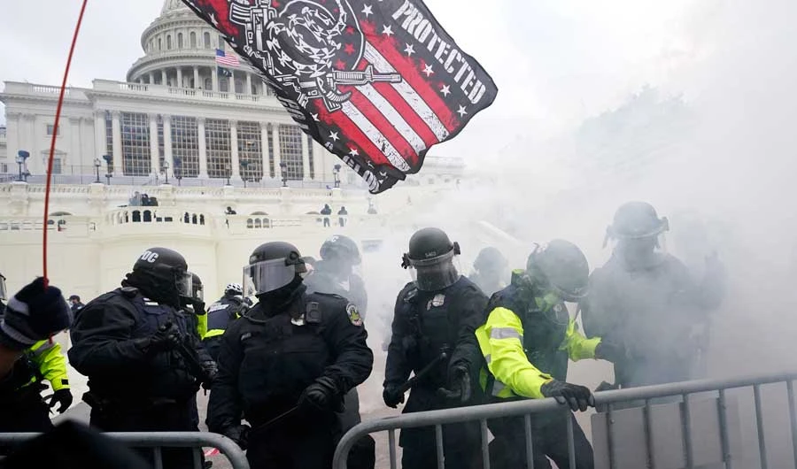 In this Jan. 6, 2021, file photo police hold off supporters of Donald Trump who tried to break through a police barrier at the Capitol in Washington. (AP)