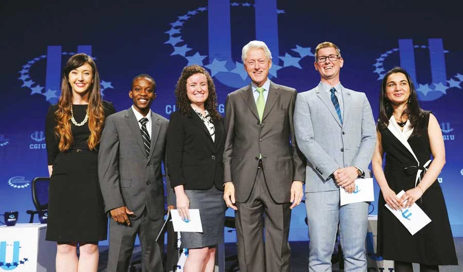 Mariam Nusrat Adil, right, shares the stage with former US President Bill Clinton, third from right, at a 2015 University of Miami conference. (Supplied)