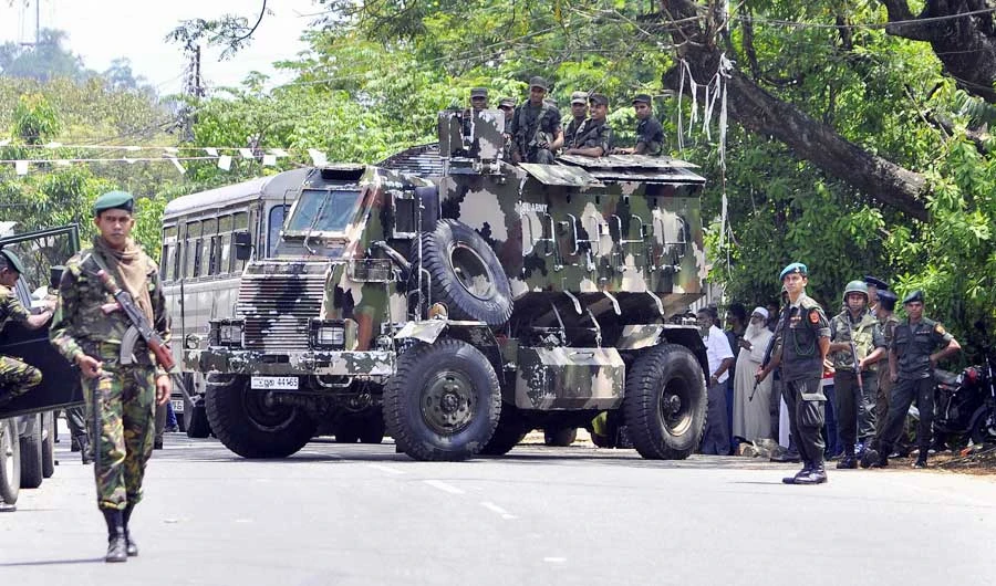 Sri Lankan police commandos patrol on the streets of Pallekele, a suburb of Kandy, on March 6, 2018, following anti-Muslim riots that has prompted the government to declare a state of emergency. (AFP)