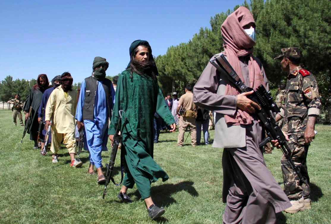 Afghan Taliban hand over their weapons to the Afghan government as they join the peace program in Herat province, Afghanistan June 24, 2021. (Reuters)