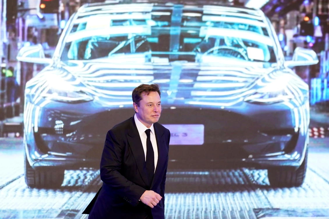 Tesla Inc CEO Elon Musk walks next to a screen showing an image of Tesla Model 3 car during an opening ceremony for Tesla China-made Model Y program in Shanghai, China January 7, 2020. (Reuters/File)