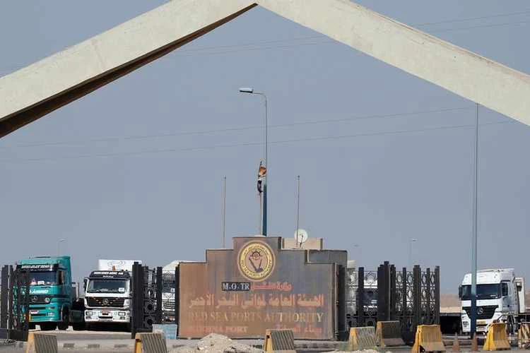 Trucks are seen parked at the main gate of the Ein Sokhna port, after passing the Suez Canal, near Suez city, Egypt. (Reuters/File)