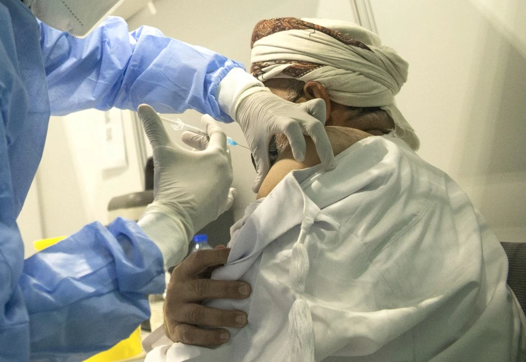 A human receives a dose of the Pfizer/BioNTech Covid-19 vaccine at the Oman Convention & Exhibition Centre in the capital Muscat on June 23, 2021. (File/AFP)