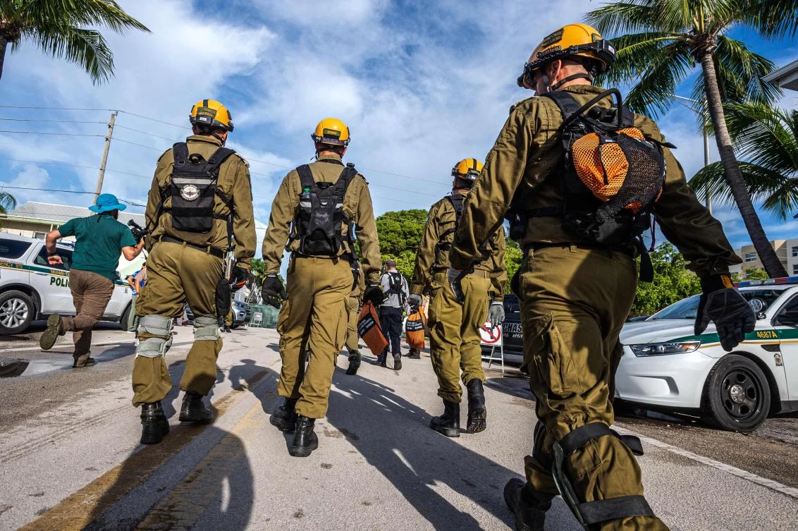 Members of the Israel Rescuers delegation gather in the area near the partially collapsed condo building in Surfside, Florida, June 27, 2021. (AFP)
