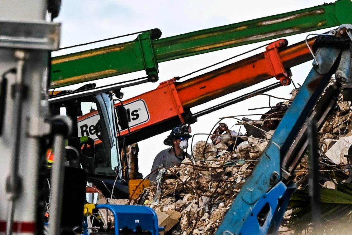 Six to eight teams of rescuers are actively searching the pile at any given time, with hundreds of team members on standby ready to rotate in. (AFP)