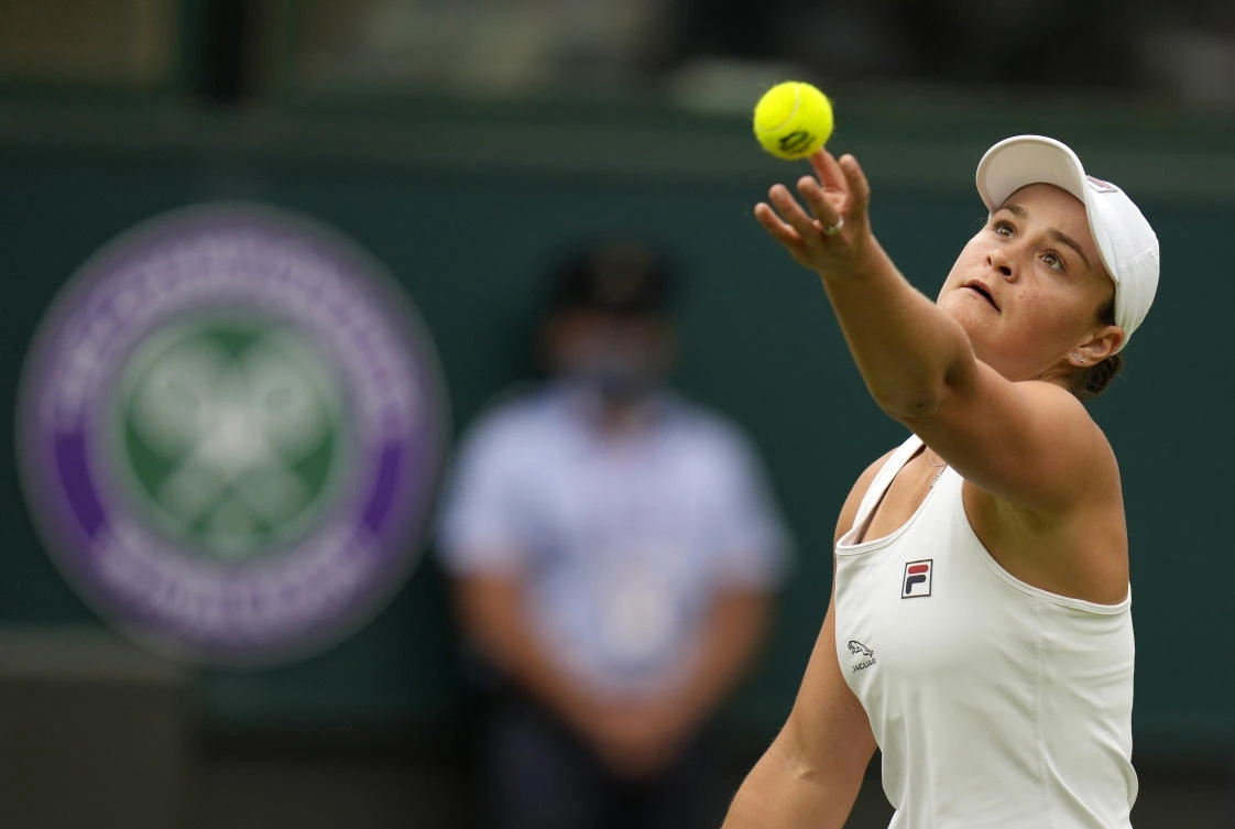 Barty through as rain hits Wimbledon again