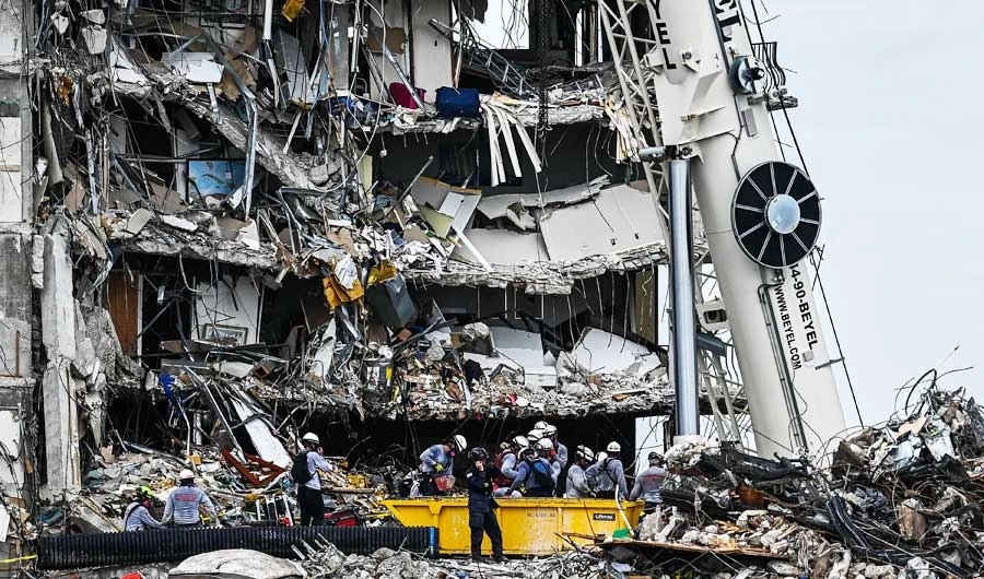 Search and Rescue teams look for possible survivors in the partially collapsed 12-story Champlain Towers South condo building on June 29, 2021 in Surfside, Florida. (AFP)