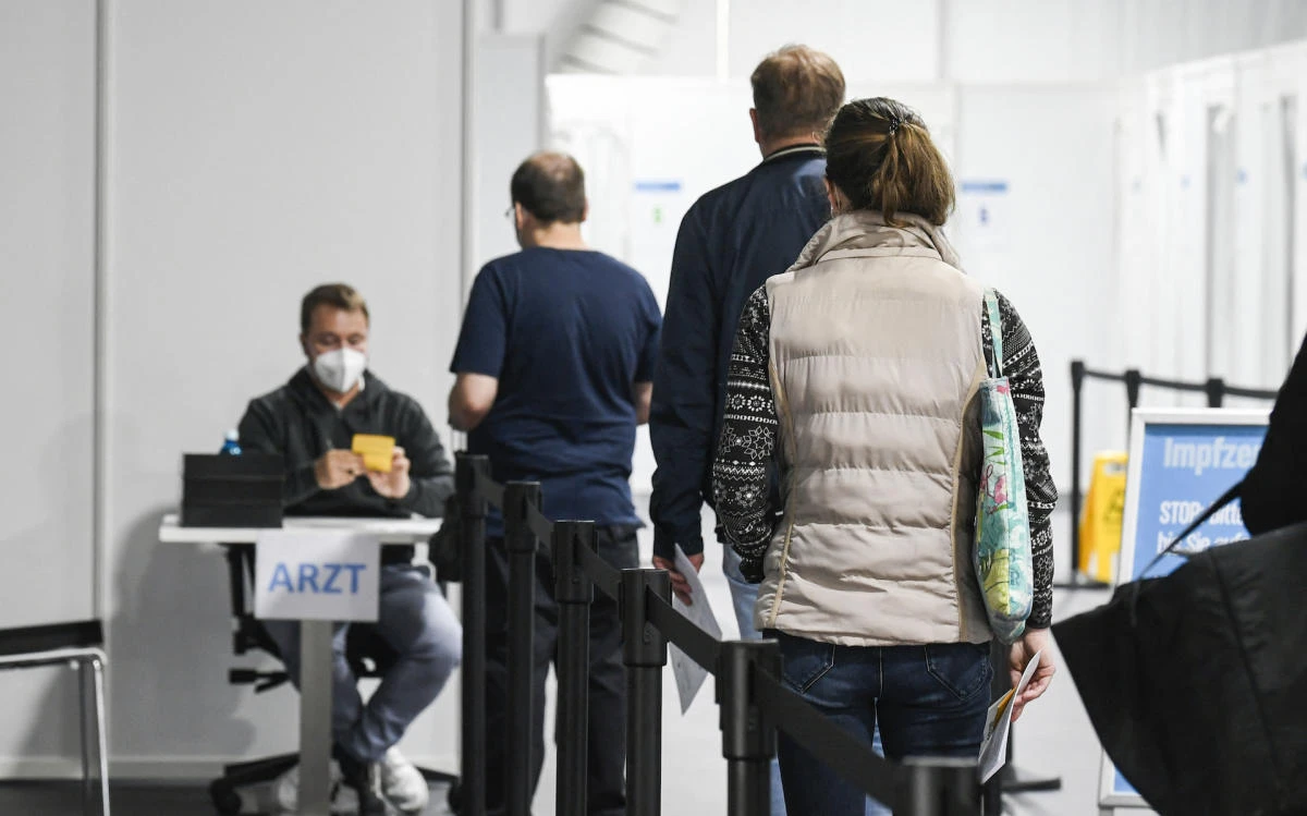 Employees wait for their registration to receive a vaccination with the Pfizer BioNTech vaccine at the vaccination center in western Germany. (File/AFP)