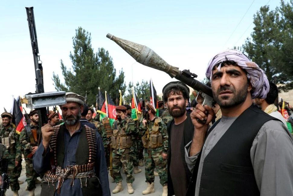Armed men attend a gathering to announce their support for Afghan security forces and that they are ready to fight against the Taliban, on the outskirts of Kabul, Afghanistan, June 23, 2021. (Reuters)