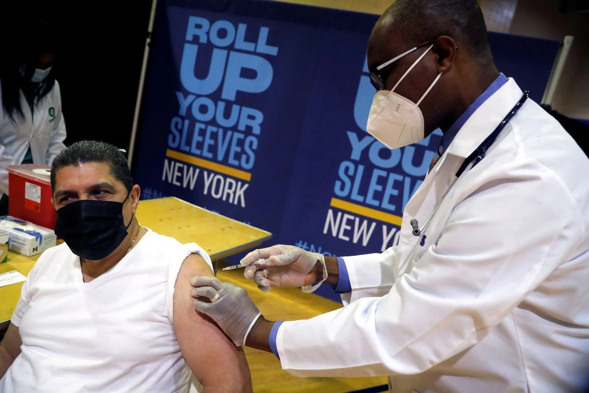 Eugenio Brito, VP of Bodegas of America, receives a Pfizer vaccination shot amid the COVID-19 pandemic, New York, U.S., Apr. 23, 2021. (Reuters)