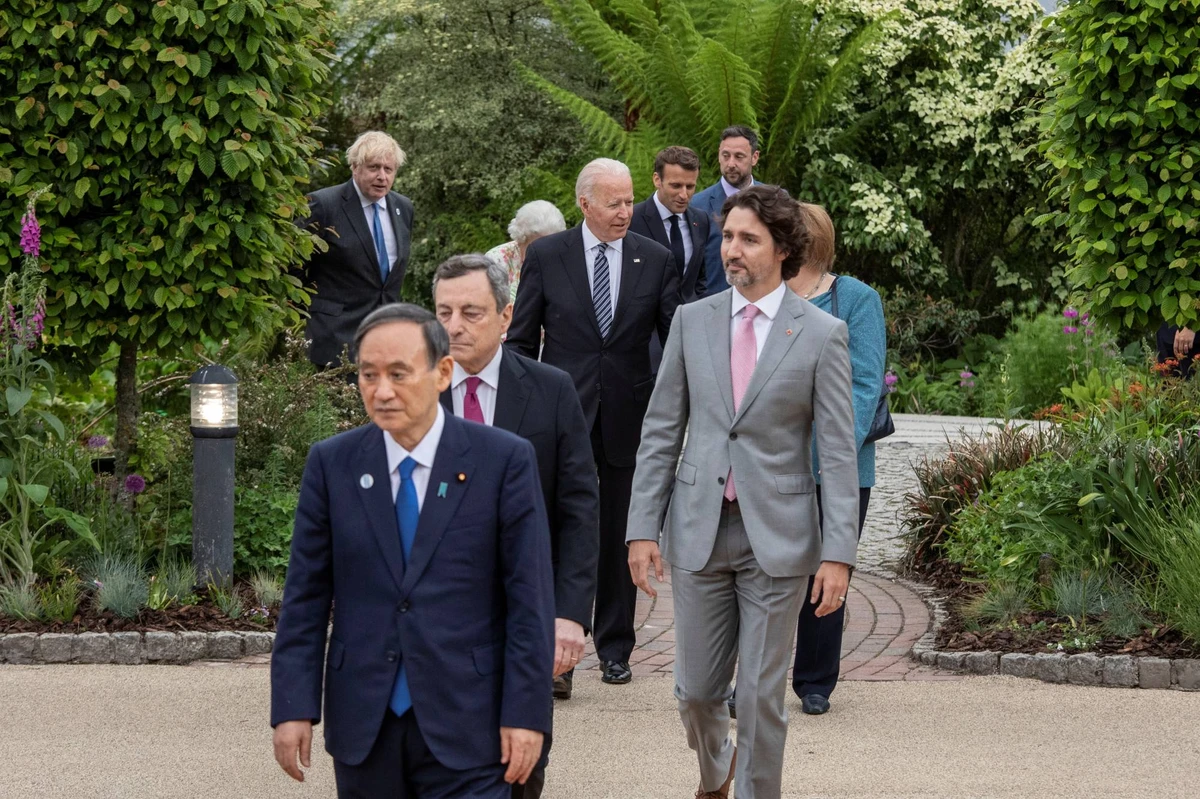 Japanese PM Yoshihide Suga heads to a reception with other Group of Seven leaders on the sidelines of their summit in Cornwall, U.K. (Reuters)