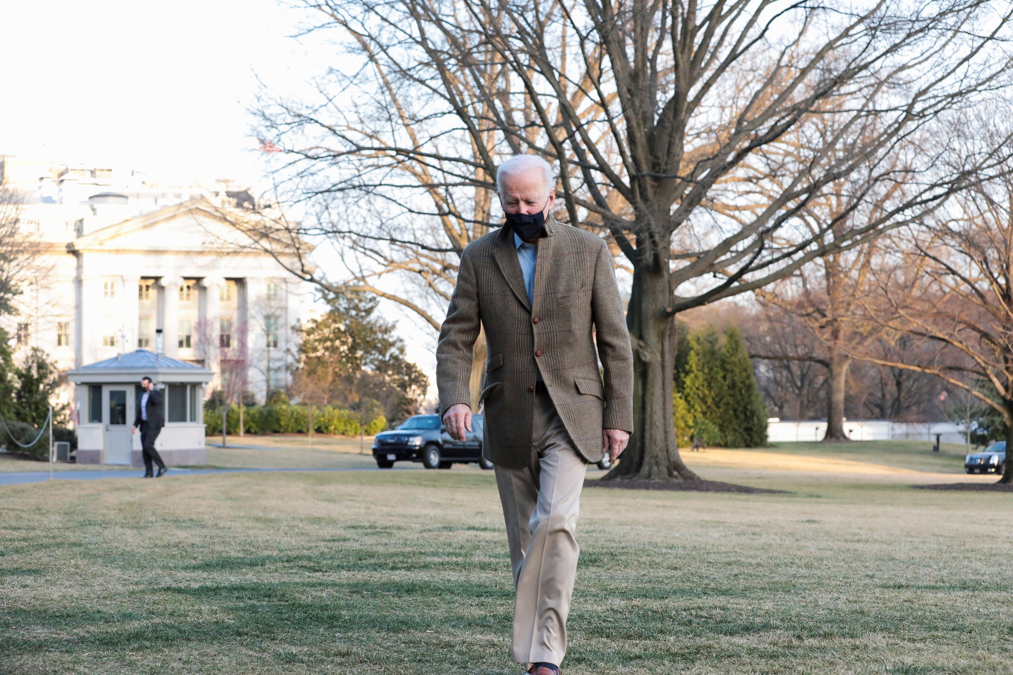 U.S. President Joe Biden walks, across the South Lawn of the White House, towards reporters, in Washington, U.S., March 14, 2021. (Reuters)