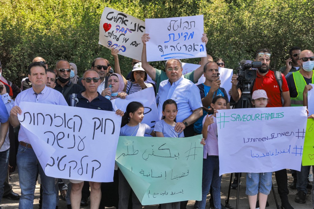 Ayman Odeh (L) and Ahmad Tibi (C) attend a protest against the Israeli citizenship law outside the Knesset. (File/AFP)