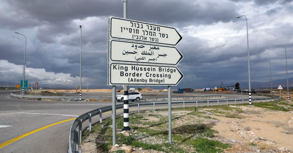 A road sign indicates the Allenby, King Hussein, bridge crossing point to Jordan in Jericho, occupied West Bank, Jan. 28, 2021. (AFP)