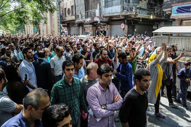 Protesters gather near Tehran’s Grand Bazaar, June 2018. (AP Photo)