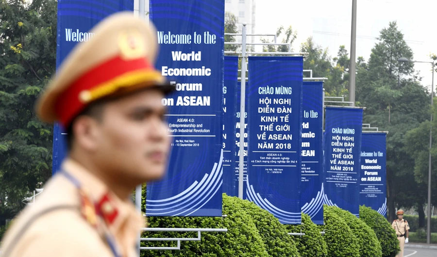 Vietnam police personnel guard the compound of the National Convention Center in Hanoi, the venue of the World Economic Forum on ASEAN on September 11, 2018. (AFP)