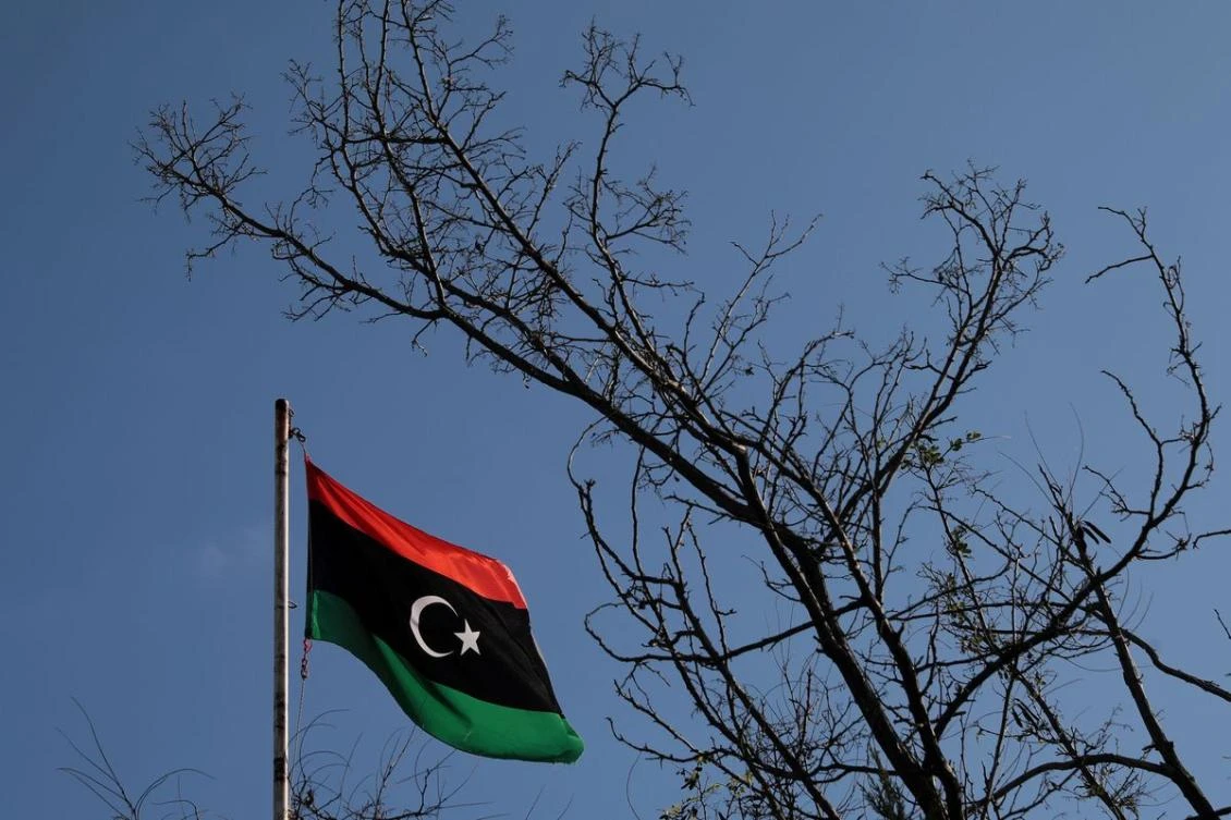 A Libyan flag flutters atop the Libyan Consulate in Athens, Greece. (File/REUTERS)