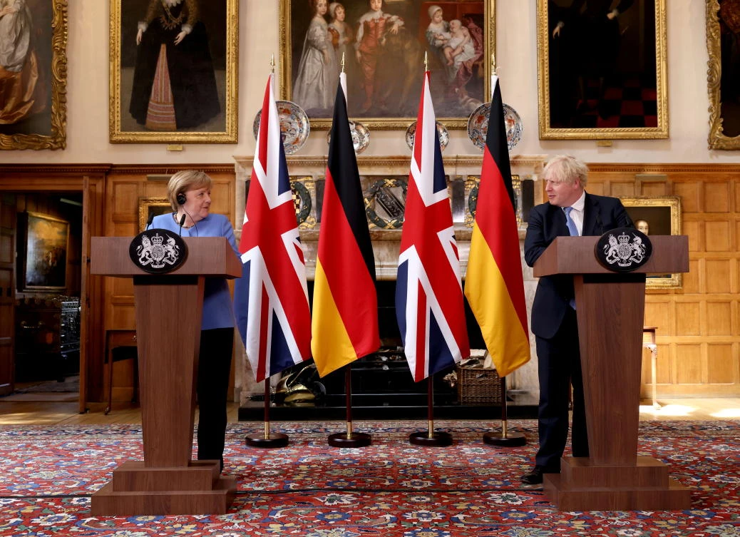 German Chancellor Angela Merkel and Britain’s Prime Minister Boris Johnson attend a news conference at Chequers, the official country residence of the PM, in Buckinghamshire on Friday. (Reuters)