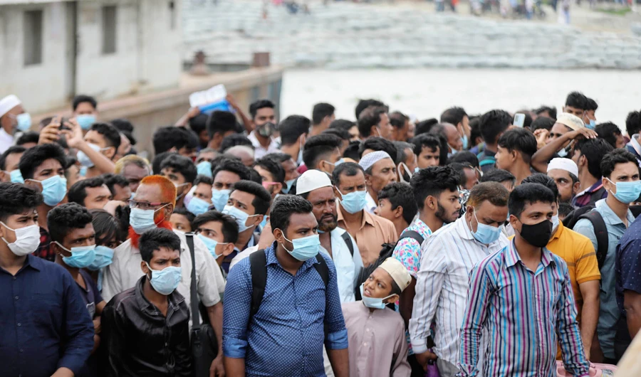 People crowd a ferry terminal to leave the city ahead of a lockdown set to start on July 1, at the Shimulia ferry terminal in Munshiganj, on the outskirts of Dhaka, Bangladesh, Wednesday, June 30, 2021. (AP)