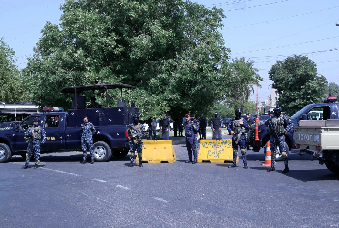 Iraqi security forces close the heavily fortified Green Zone government areas, during a symbolic funeral of the slain Popular Mobilization Forces fighters on June 29, 2021. (AP)