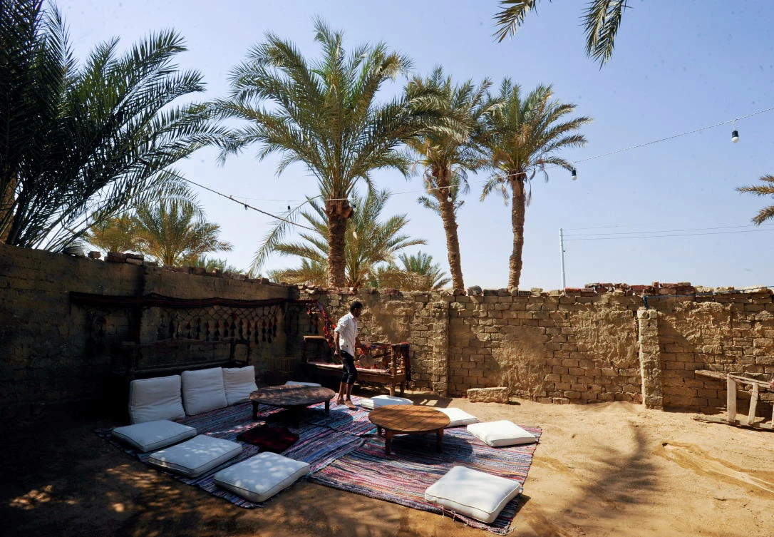 Tourists are served food cooked by Saqqara residents who try to improve their living conditions in their village, in Giza, Egypt. (Reuters)