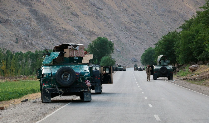 Afghan soldiers pause on a road at the front line of fighting between Taliban and Security forces, near the city of Badakhshan, northern Afghanistan, Sunday, July. 4, 2021. (AP)