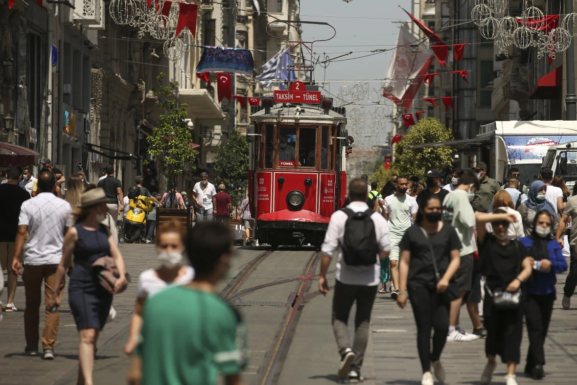 People walk on Istiklal Street, the main shopping street in Istanbul, where the impact of accelerating inflation is visible. (AP)