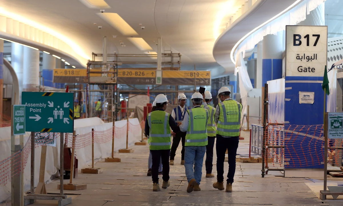 Visitors tour the construction site of the midfield terminal of Abu Dhabi International Airport in Abu Dhabi. (Reuters)