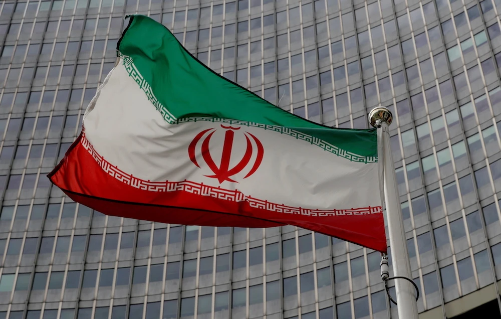 An Iranian flag flutters in front of the International Atomic Energy Agency headquarters in Vienna, Austria. (File/Reuters)