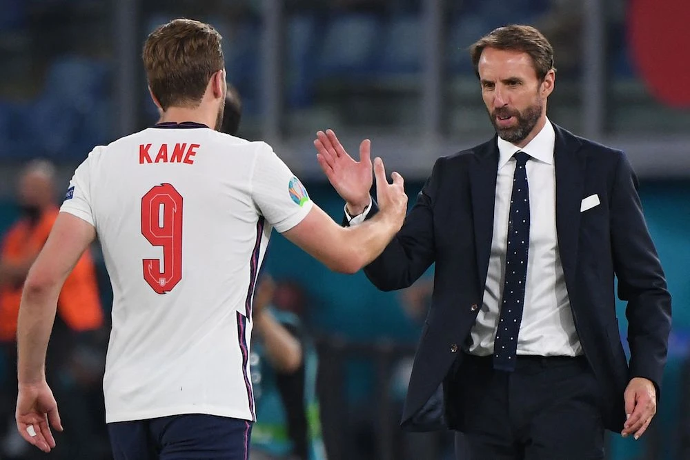 England's coach Gareth Southgate greets England's forward Harry Kane after being substituted during the quarter-final against Ukraine. (AFP)